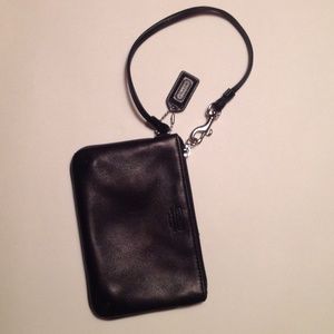 Genuine leather, black Coach wristlet.
