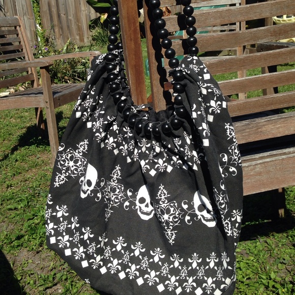 Skull print cloth bag with beaded handles...
