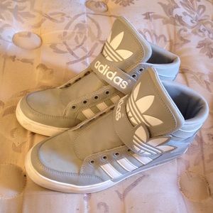 Gray and white high top Adidas