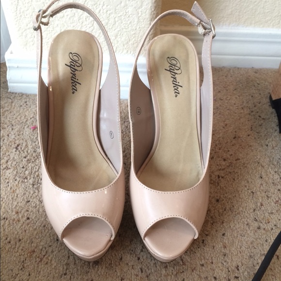 Beige platform sling backs.