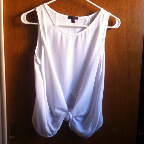 White silky top with an opening in the back