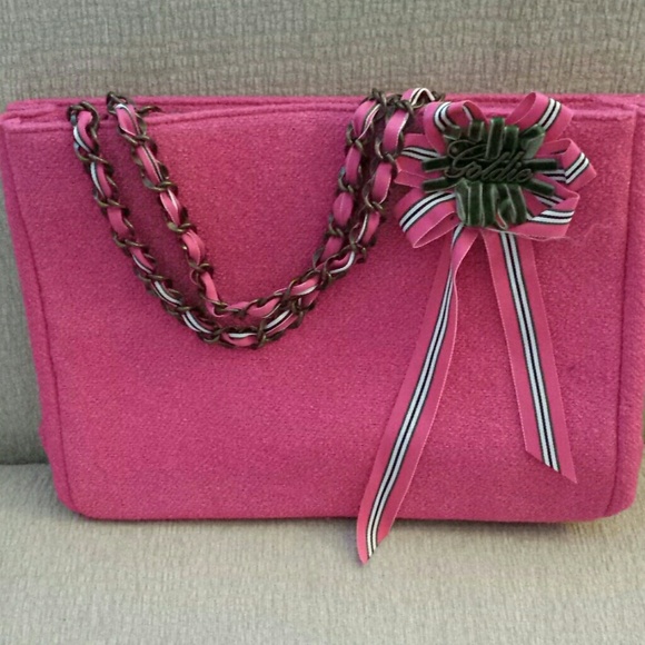 Hot pink purse,  make up bag.