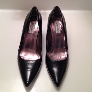 Black pointy toe heels.