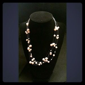 Sophisticated floating pearl necklace.