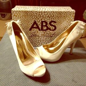 White fancy heels by Allen Schwartz.