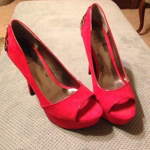 Carlos Santana red suede heels.