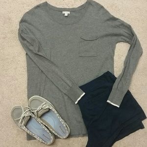Charcoal gray sweater with cream sleeve stripe