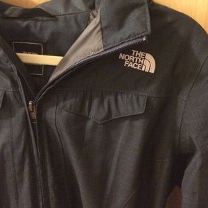 Dark blue hooded long North Face rain coat