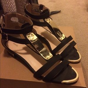 Black and gold strappy sandals