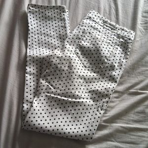 White stretch skinny jeans with black polka dots