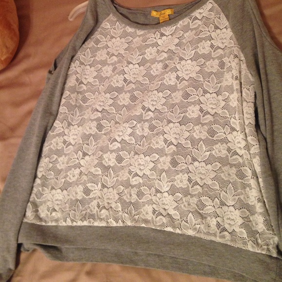 A long sleeved lace shoulder cut out top