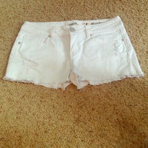 White distressed shorts.