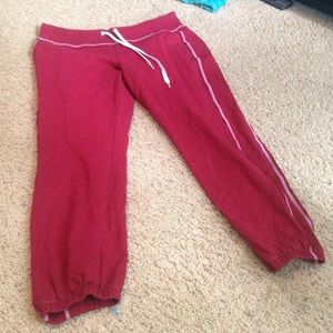 Dark red roll-up sweatpants.
