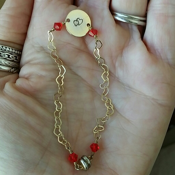 Dainty gold tone bracelet with heart links