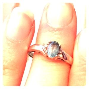 14k White gold Blue Topaz ring with small diamonds