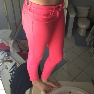Neon pink skinny jeans