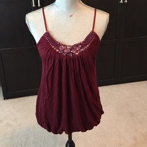 Maroon embellished top.