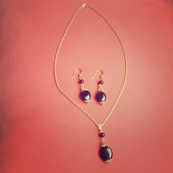 Gold necklace with black pendant