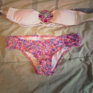 White bikini top with pink floral bottoms