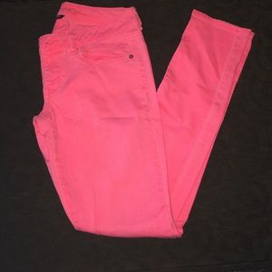 Neon pink skinny jeans