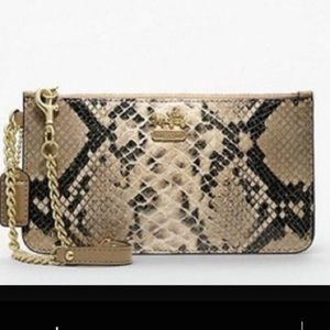 Authentic Coach snake skin wristlet.