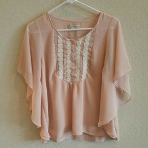 Blush and white blouse