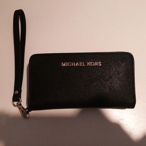 Authentic Michael Kors black clutch.