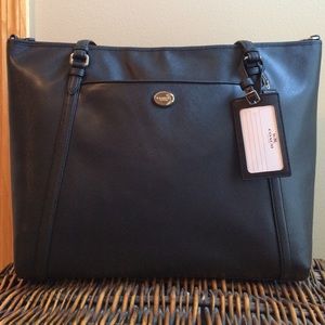 Coach Peyton XL carry on luggage. New with tags.