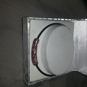 Silver bangle with pink rhinestones