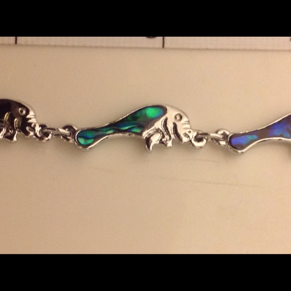Georgeous abelone bracelet w/graceful manatees.