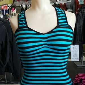 It's a stretchy material tank tops criss cross.