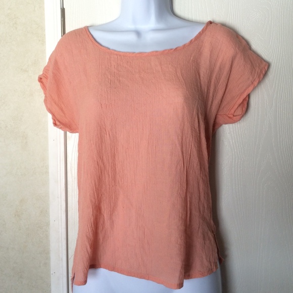 Peach shirt. With back braid cutout.