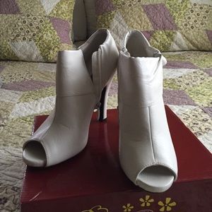 White open-toe booties