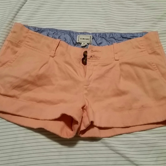 peach shorts with brown buttons