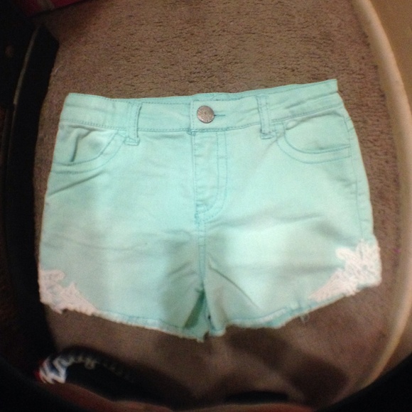 Teal shorts with lace on side 👖
