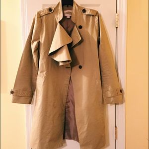 Trench coat with asymetrical draped collar.