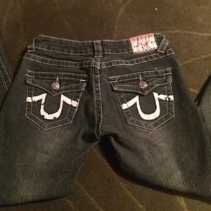 Dark wash true religion jeans with white label