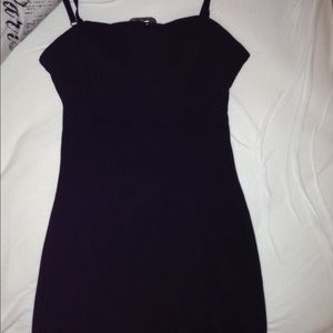 A mini black dress by Guess