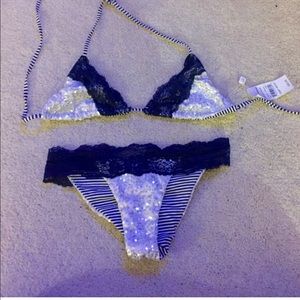Silver beach bunny bikini with blue lace trim