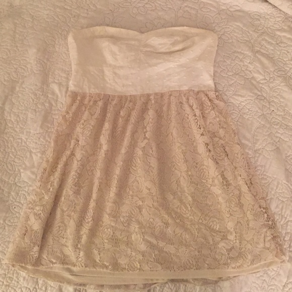 Creme fit and flare strapless lace dress.