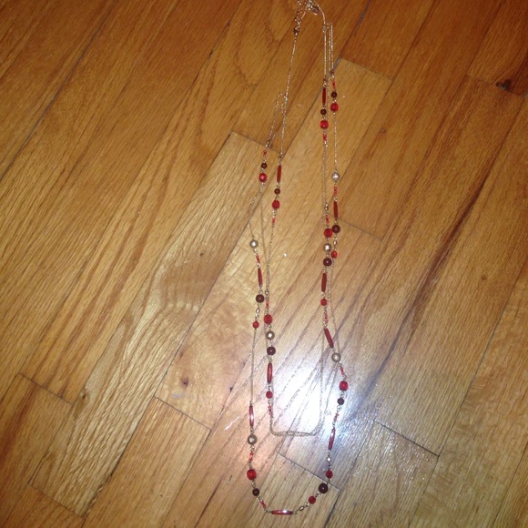 Red beaded necklace. Gold chain