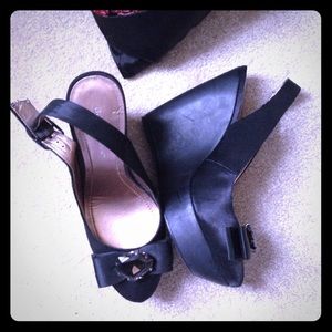 BCBG black Wedges with bow embellishment.
