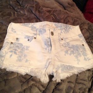White denim shorts with blue flowers