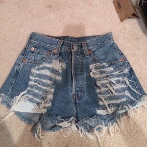 Levi high waisted ripped Jean shorts.