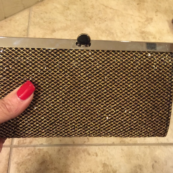 Bebe small gold clutch