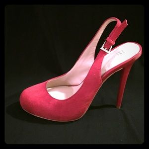 Red suede sliding pump heels