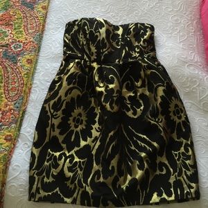 Black and gold strapless cocktail dress
