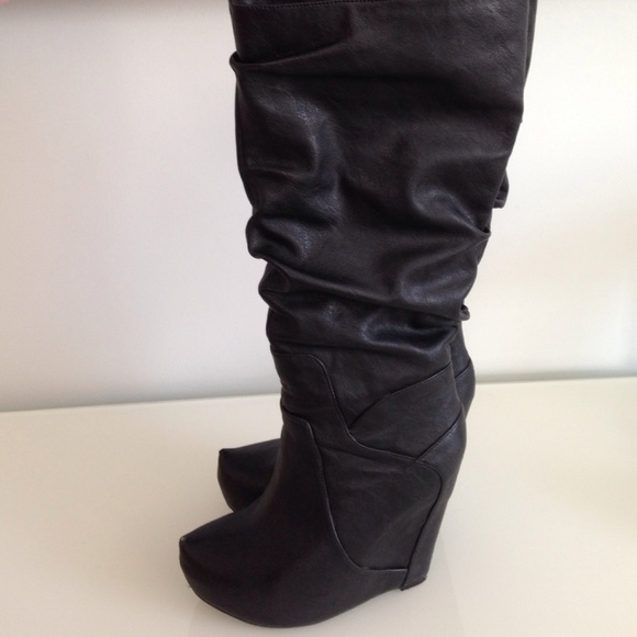 Black leather wedge boots