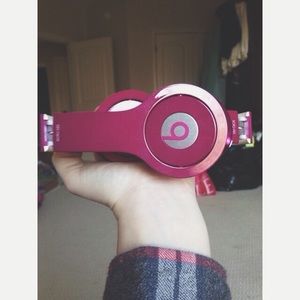 HOLD: beats by dre // solo headphones in magenta.