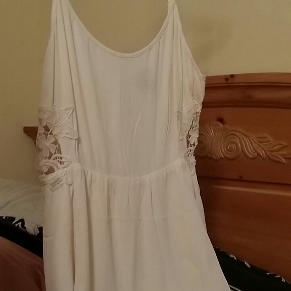 White dress with lace cutouts on the side
